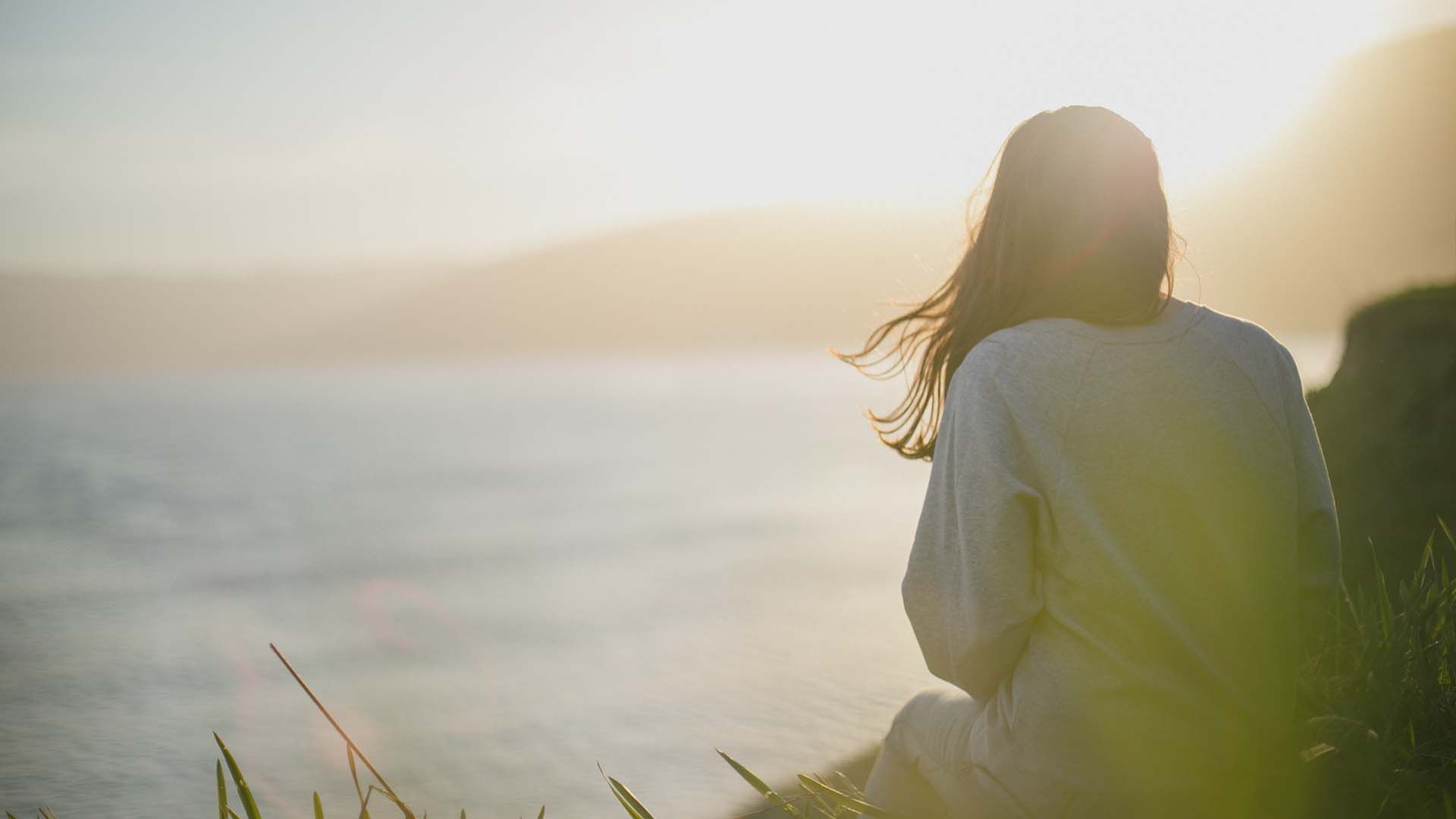 Peaceful woman looking at the sea