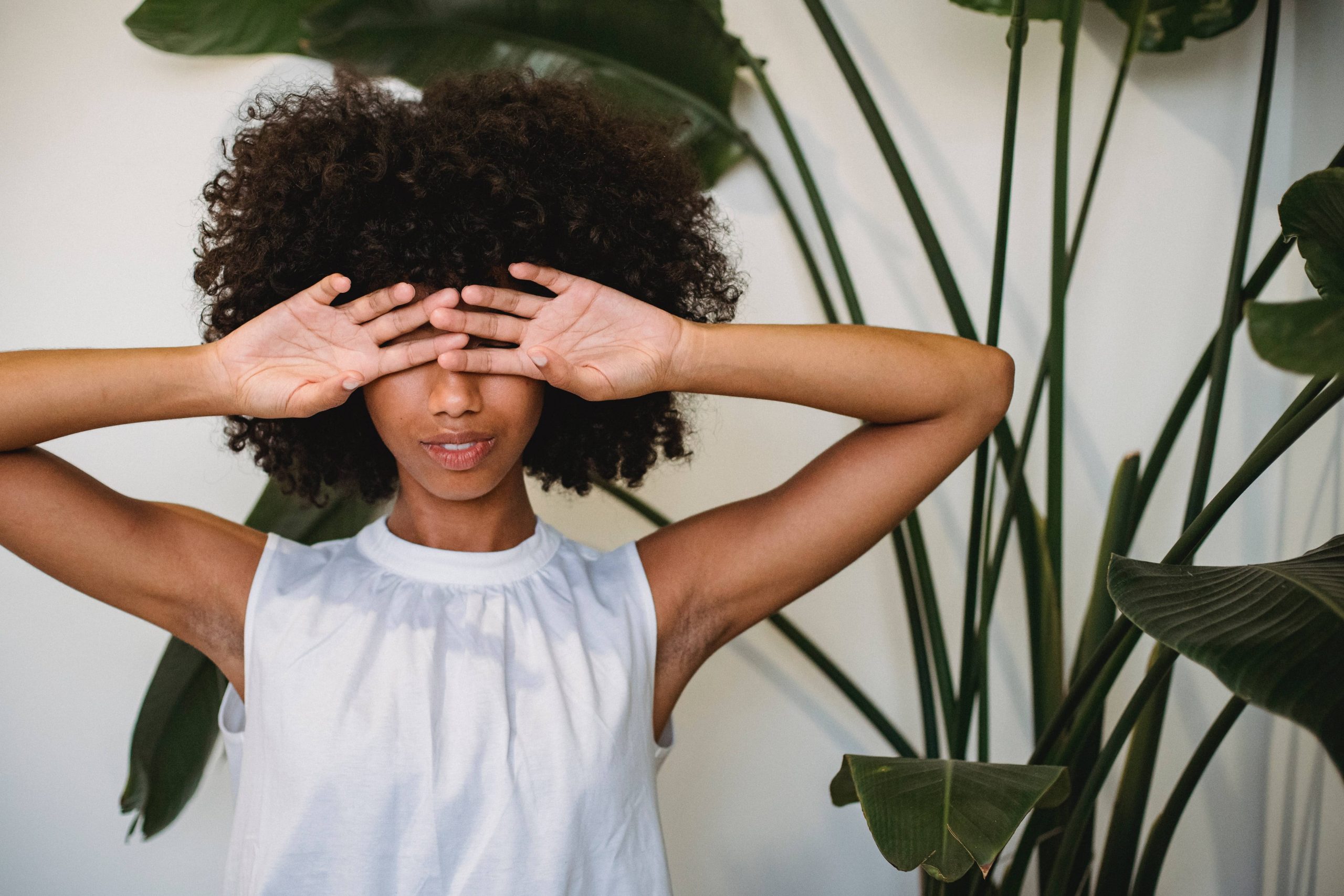 woman covering her eyes with her hands