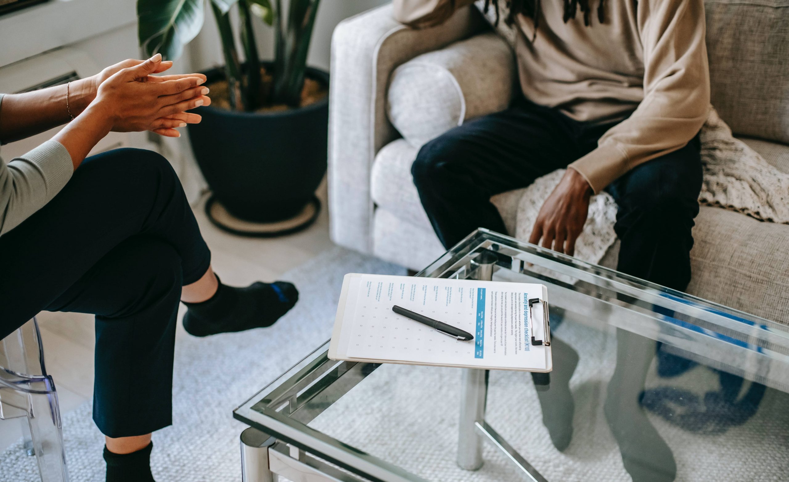 Therapist and therapy client sitting in room