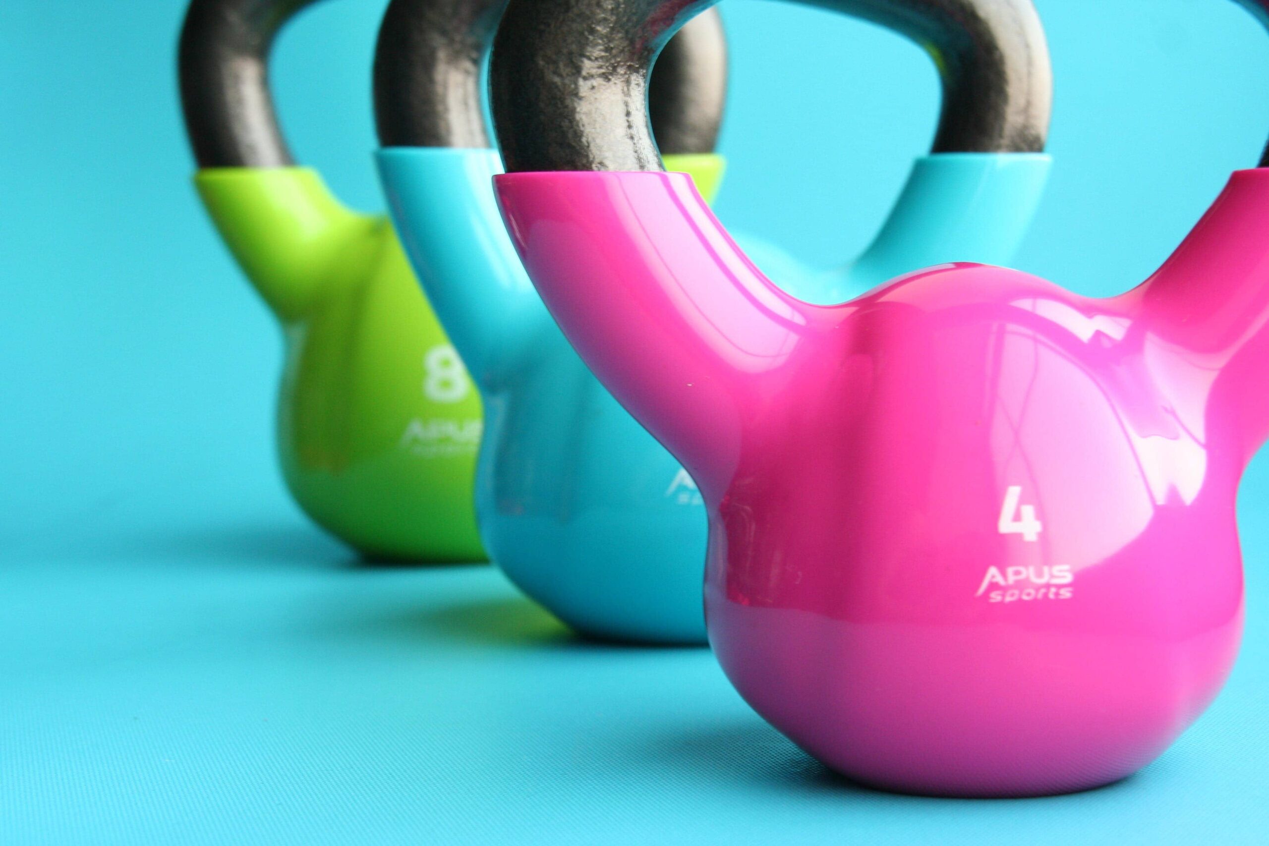 Kettlebells in pink, blue and green