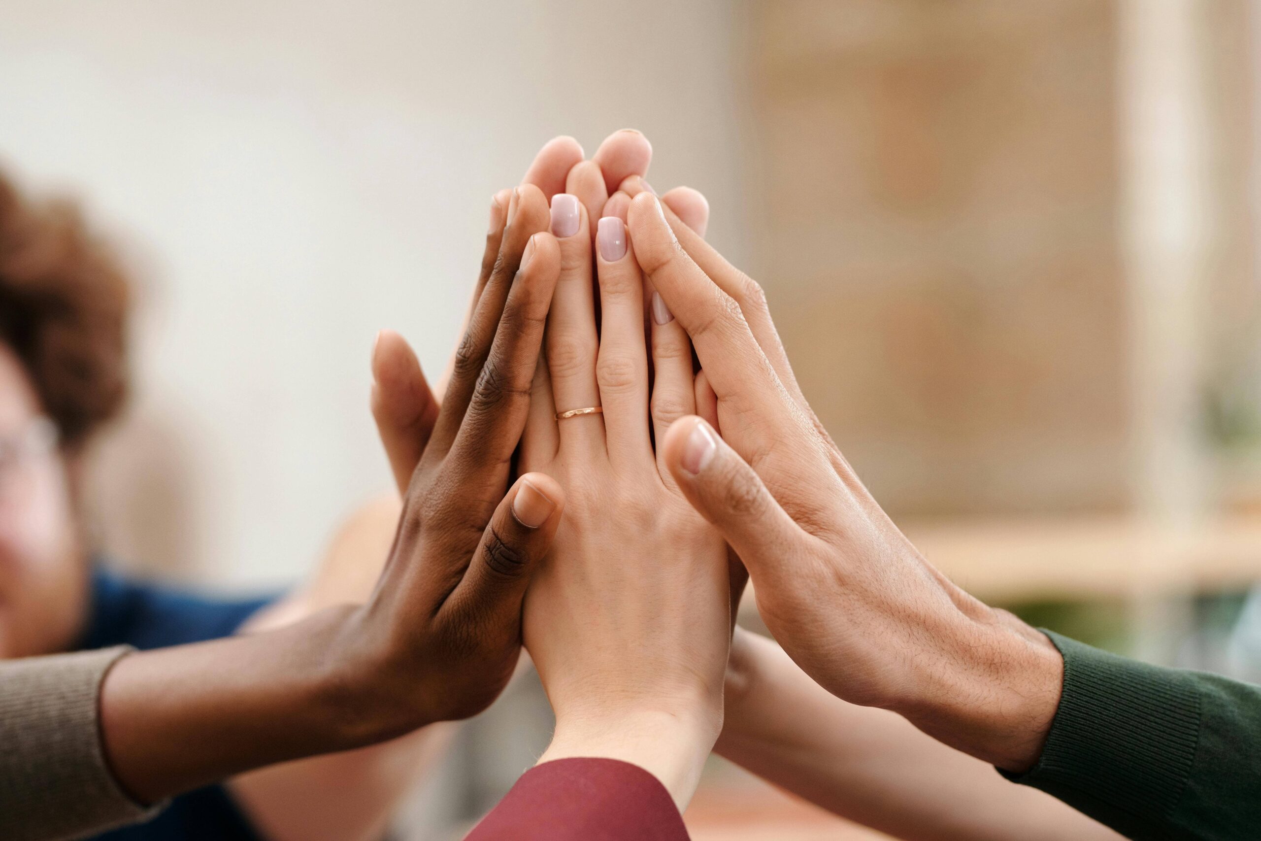 Different hands connecting