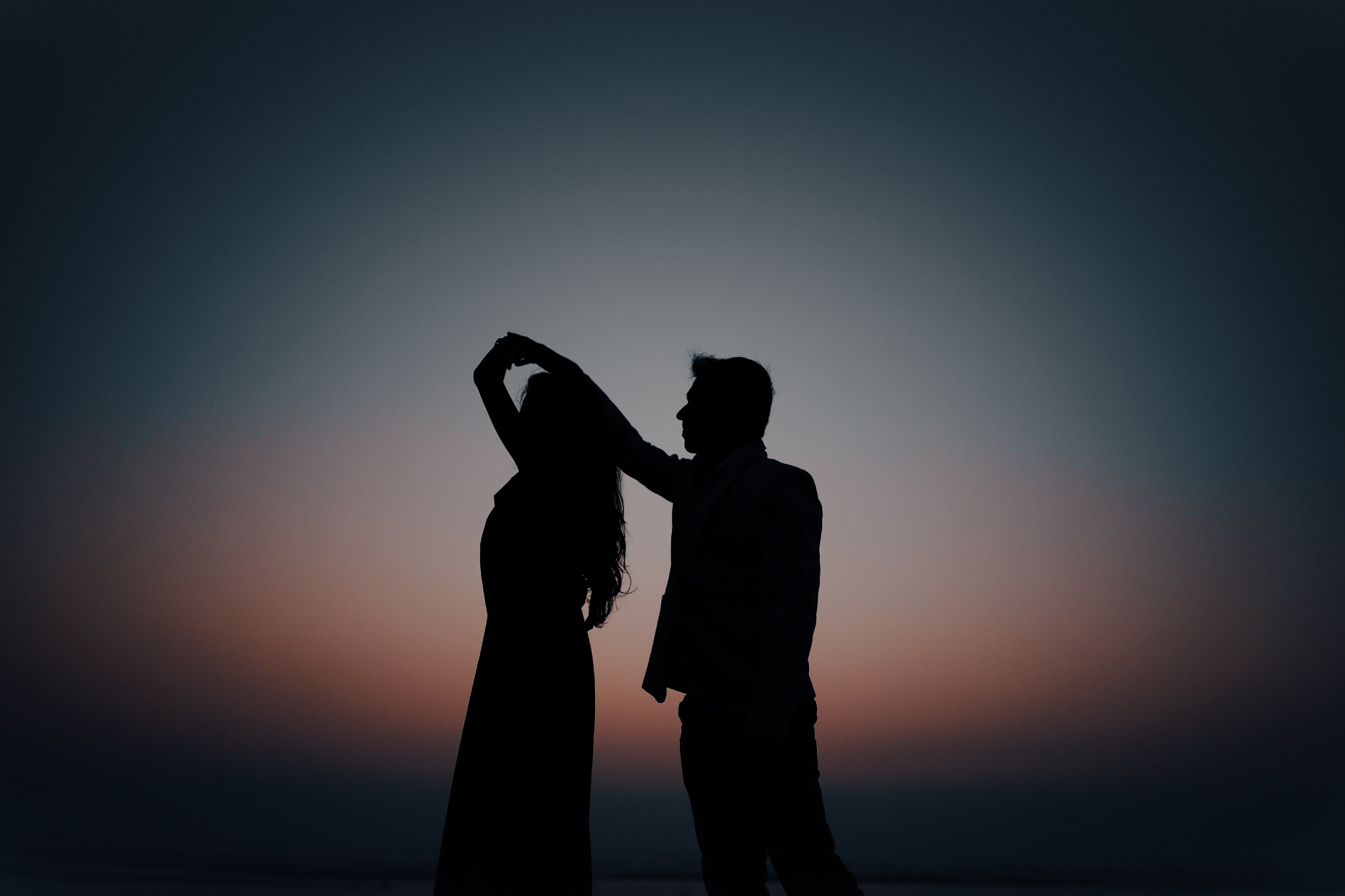 Silhouette of a couple dancing 